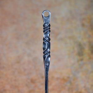 Hand-forged fire poker with water twist handle and small hanging loop. Fireside tools, handmade by blacksmith