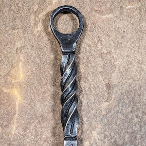 Hand-forged fire poker with twist handle, blacksmith made