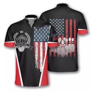 May include: Black bowling jersey featuring a distressed American flag design and a bowling pin graphic. The jersey has a zip fastening and the name "MICHAEL" is printed on the front.