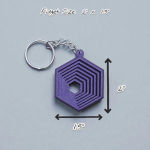 Handmade and customizable hex fidget keychains shown in indigo purple, featuring colorful designs, perfect for kids birthday parties, classroom prizes, sensory play, and party favor gifts.