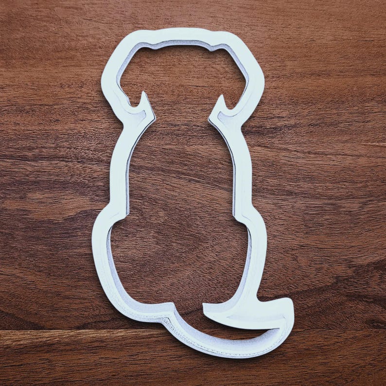 Dog-shaped cookie cutter made from compostable bioplastic, ideal for baking full-sized dog treats, fondant crafts, or clay projects.