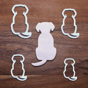 Dog-shaped cookie cutters made from compostable bioplastic, ideal for baking full-sized dog treats, fondant crafts, or clay projects.