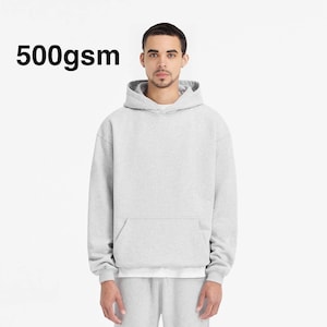 May include: A gray hooded sweatshirt with a pouch pocket. The sweatshirt is made of 500gsm fabric.