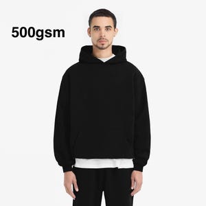 May include: A black hooded sweatshirt with a pouch pocket. The sweatshirt is made of 500gsm fabric.