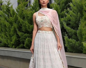 Skirt Crop-Top Three-Piece Set: Off-White Printed Silk Blouse with Elegant Zari Work and Flared Long Crepe Lehenga Perfect for Party Wear