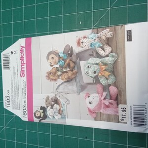 May include: A Simplicity sewing pattern for making stuffed animals. The pattern includes instructions for making a monkey, a dog, a horse, and a pig. The pattern is for size K and costs $17.95.