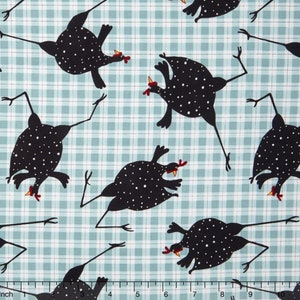 May include: A blue and white plaid fabric with a repeating pattern of black and white spotted chickens. The chickens are in various poses, some with their legs in the air.