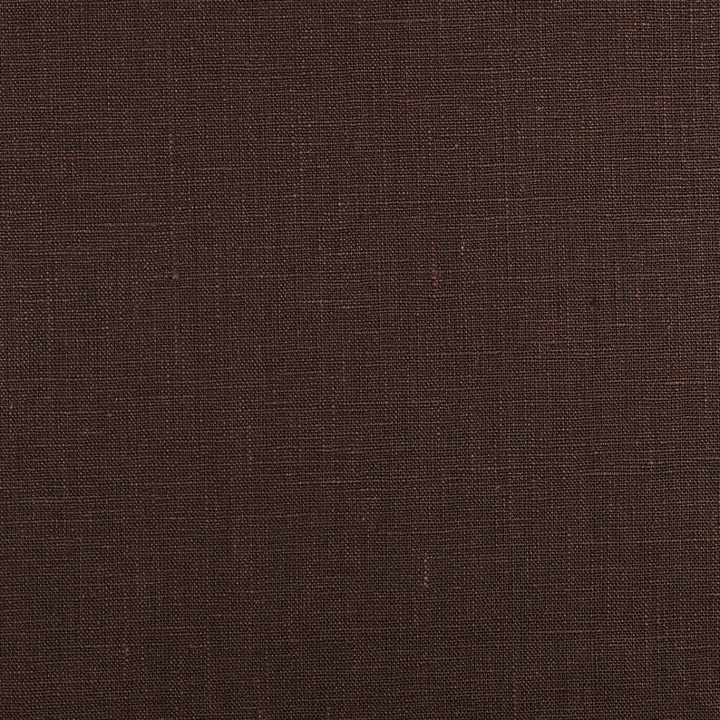 May include: A close-up of a brown fabric with a woven texture.
