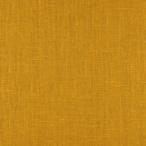 May include: A close-up of a yellow fabric with a woven texture.