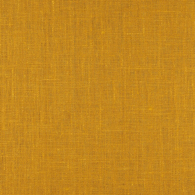 May include: A close-up of a yellow fabric with a woven texture.