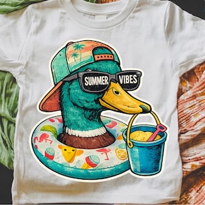 May include: White t-shirt with a cartoon duck wearing sunglasses that read "SUMMER VIBES." The duck is in a swim ring and holding a bucket with sand and a shovel. The duck is wearing a hat with a palm tree design.