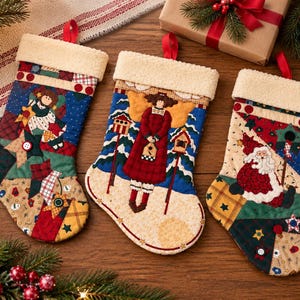 May include: Three quilted Christmas stockings featuring patchwork designs with appliqued figures including an angel holding a star, an angel with birdhouses, and Santa Claus. Each stocking has a cream-colored faux sherpa cuff and a red hanging loop.