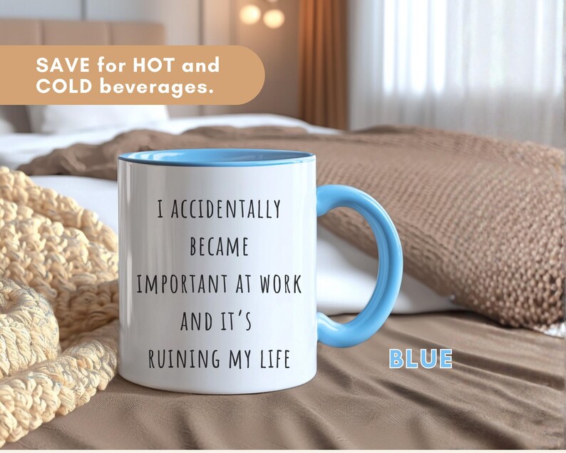 May include: White ceramic mug with a blue handle and interior. The mug has the text "I ACCIDENTALLY BECAME IMPORTANT AT WORK AND IT'S RUINING MY LIFE" printed on it. The mug is designed for hot and cold beverages.
