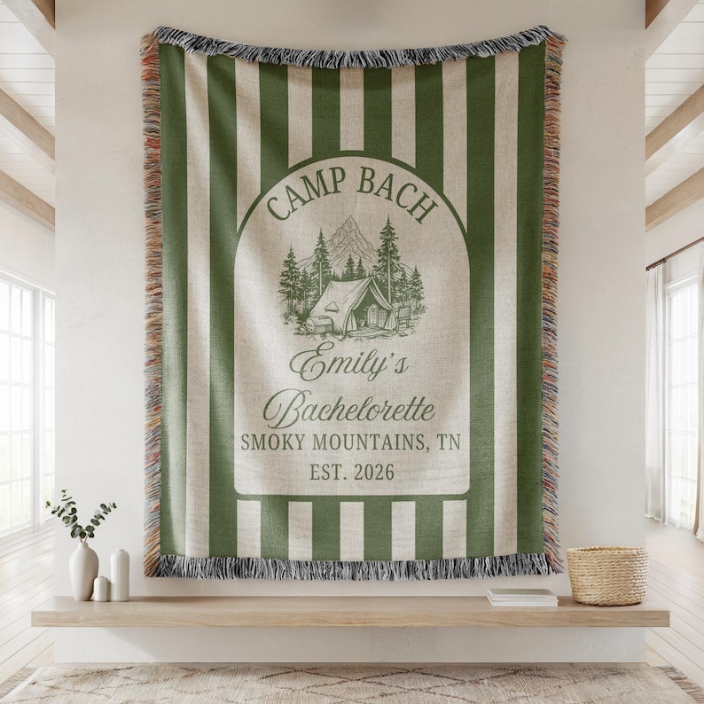 Personalized woven blanket designed for a camp themed bachelorette party featuring custom bride tribe text, used as glamping decor, photo backdrop, and cozy keepsake throw gift.
