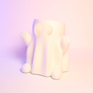 May include: White ceramic ghost figurine with two eye holes. The ghost is standing on a white surface.