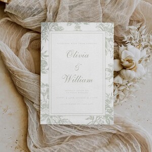 May include: A wedding invitation featuring the names "Olivia & William" in elegant script. The invitation has a light green floral border and text, with the date and time of the wedding at the bottom. The invitation is on a textured white background.
