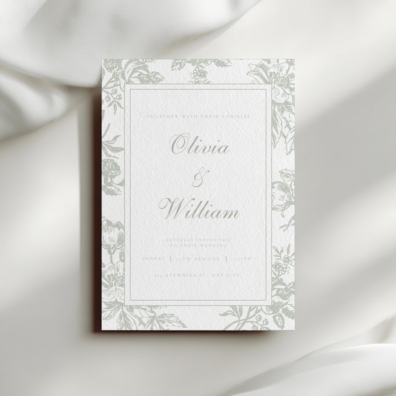 May include: A rectangular wedding invitation with a floral border in a soft green hue. The invitation features the names "Olivia & William" in elegant script. The text is centered on a white background.