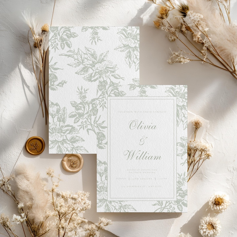May include: Wedding invitation suite featuring a floral design in soft green on a white background. The invitation includes the names "Olivia & William" and event details. Two gold wax seals and dried flowers add to the elegant aesthetic.