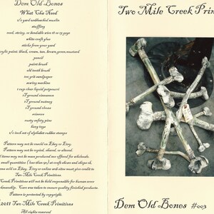 May include: A close-up of a collection of bone-like objects, painted white and green, with a rustic, primitive aesthetic. The objects are arranged on a dark surface. The image includes the text "Dem Old Bones #003".