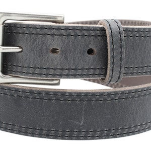 May include: A grey leather belt with double stitching and a silver buckle.