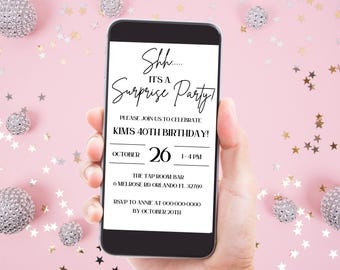 May include: A black smartphone with a white screen displaying a birthday party invitation. The invitation reads "Shh... It's a Surprise Party!" and includes details for Kim's 40th birthday party on October 26th from 1-4 PM at The Tap Room Bar. The invitation also includes an RSVP contact and deadline.