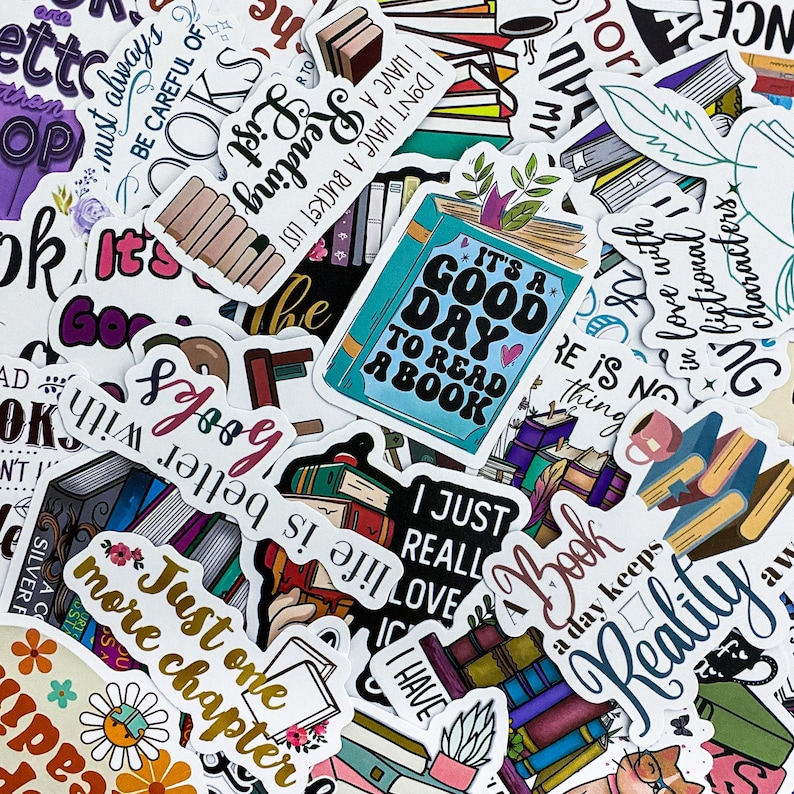 May include: A collection of colorful stickers with book-themed designs. The stickers feature phrases like "It's a good day to read a book" and "Just one more chapter." Various book illustrations and floral accents are also present.
