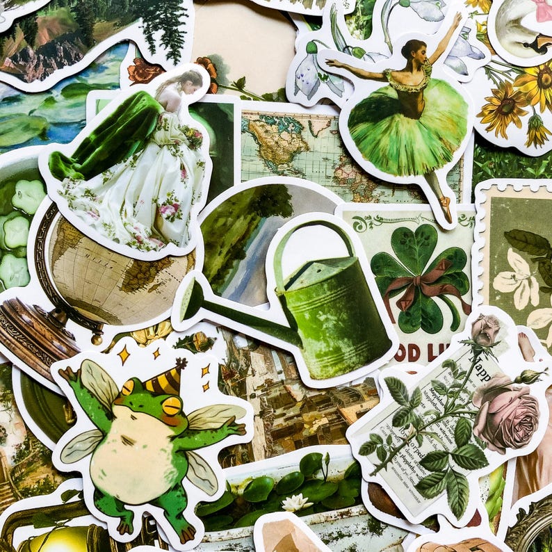 May include: A collection of green and white stickers featuring a variety of designs, including a globe, a watering can, a four-leaf clover, a frog, a rose, and a woman in a green dress. The stickers are perfect for adding a touch of whimsy to journals, planners, and other creative projects.