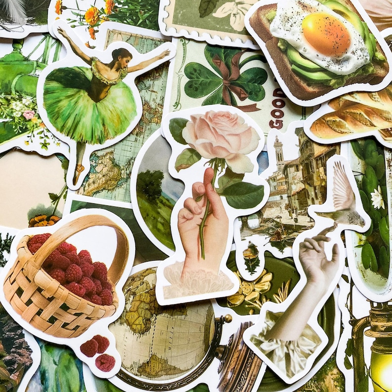 May include: A collection of vintage-style stickers featuring a variety of designs, including a ballerina, a rose, a globe, a basket of raspberries, a hand holding a rose, a breakfast sandwich, and a building with a bird flying overhead. The stickers are printed on white paper with a glossy finish.