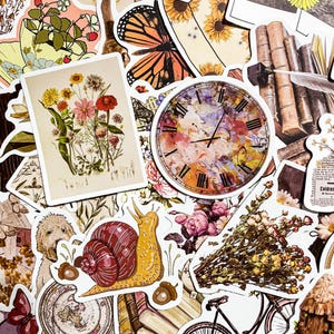 May include: A collection of vintage-style stickers featuring a variety of designs, including a clock, a snail, flowers, butterflies, and books. The stickers are printed on white paper with a matte finish.