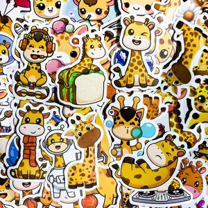 May include: A collection of colorful stickers featuring cartoon giraffes in various poses and activities. The stickers are printed on white paper and have a glossy finish.