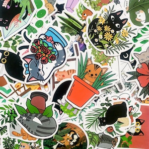 May include: A collection of colourful stickers featuring cats, plants, and flowers. The stickers are perfect for decorating laptops, water bottles, journals, and more.