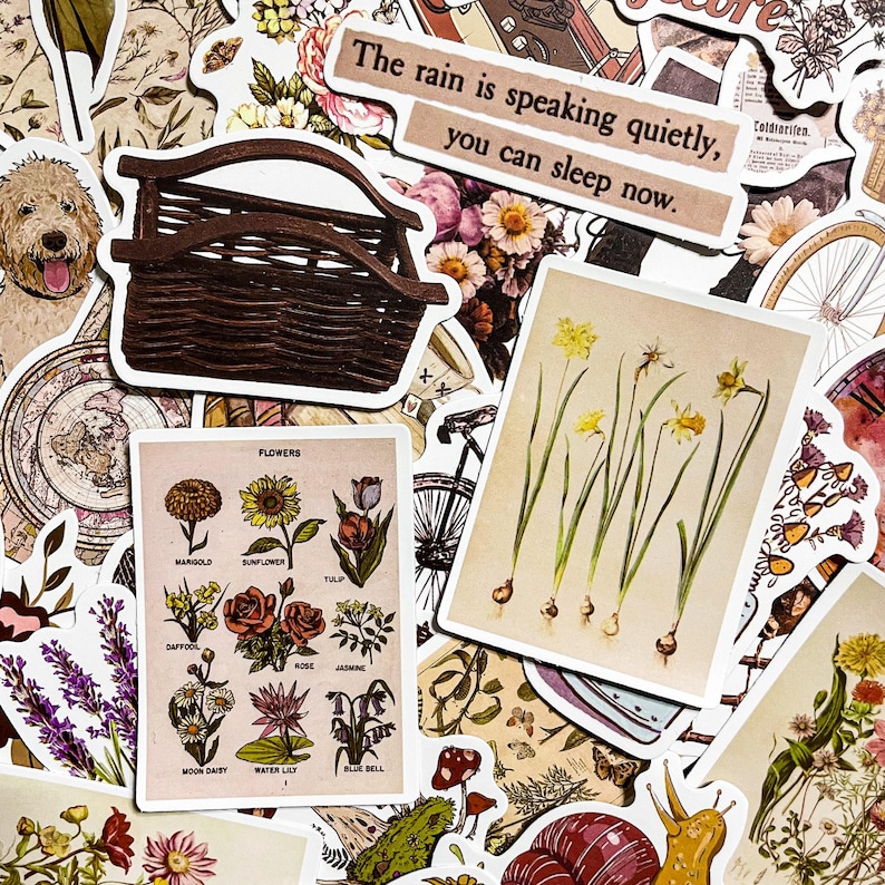 May include: A collection of vintage-style stickers featuring floral designs, a wicker basket, a quote about rain, and a botanical illustration of daffodils. The stickers are printed on white paper with a distressed look.