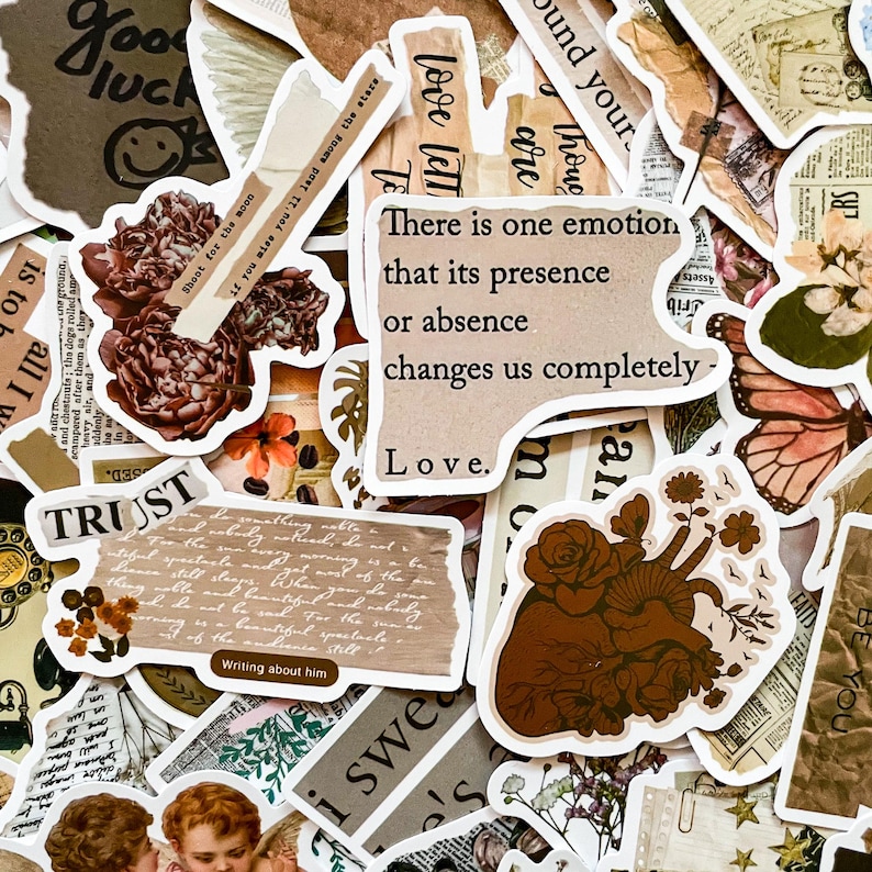May include: A collection of vintage-style stickers with various designs, including flowers, a heart with vines, and text that reads "There is one emotion that its presence or absence changes us completely - Love."