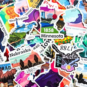 May include: A selection of vibrant stickers showcasing state outlines and landmarks. The stickers include state names such as Minnesota, Nebraska, and Alaska, alongside dates and illustrations. The stickers vary in shape and size.