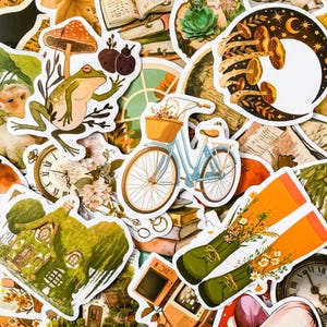 May include: A collection of colorful stickers featuring various illustrations, including a frog, a bicycle, a house, a clock, mushrooms, and a crescent moon. The stickers are perfect for adding a touch of whimsy to journals, laptops, or other surfaces.