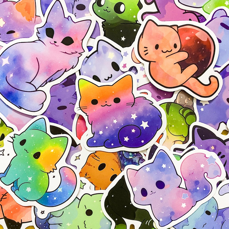 May include: A collection of colorful cat stickers with galaxy and star designs. The stickers are made of a glossy vinyl material and are perfect for decorating laptops, water bottles, journals, and more.