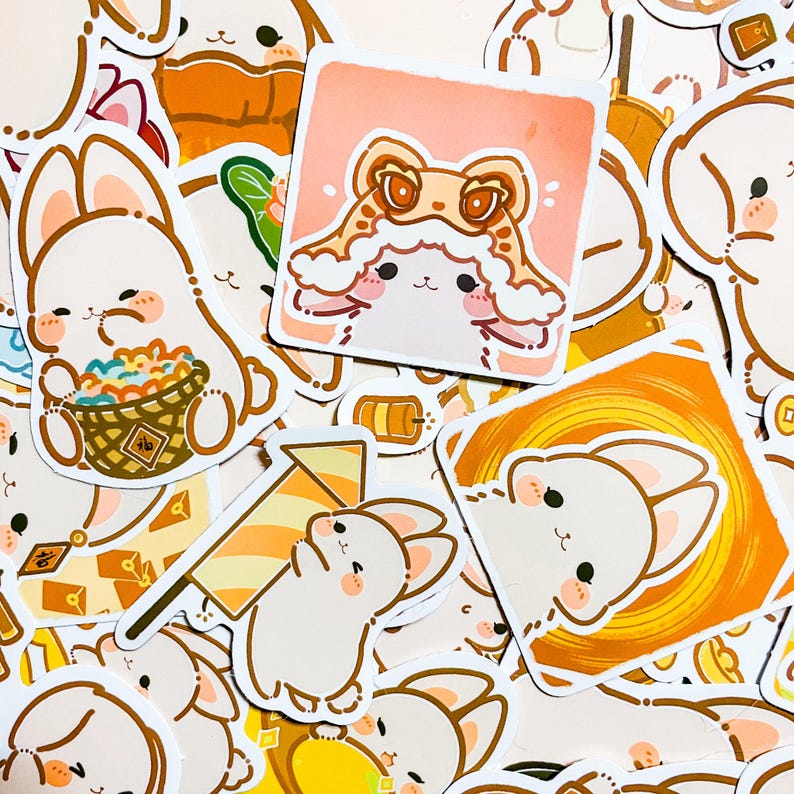 May include: A collection of colorful stickers featuring cute cartoon bunnies in various poses and settings. The stickers are printed on white paper with a glossy finish. Some of the stickers feature Chinese characters.