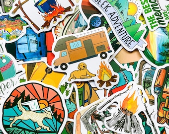 May include: A collection of colorful stickers featuring camping and outdoor adventure themes. The stickers include images of a camper van, a campfire, a dog, a mountain range, and text that says "Seek Adventure" and "The Best Memories Are Made".