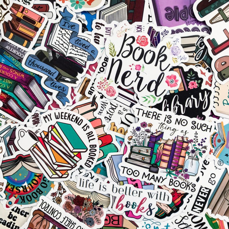 May include: A collection of colorful stickers with book-themed designs. The stickers feature phrases like "Book Nerd," "Too Many Books," and "Life is better with books." Various stickers depict stacks of books, open books, and floral accents.