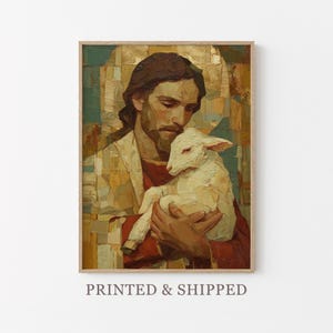 May include: A framed print of a religious painting. The artwork depicts a man with long brown hair and a beard holding a white lamb. The man is wearing a red and cream-colored robe. The background has gold and green tones. The text "PRINTED & SHIPPED" is at the bottom.