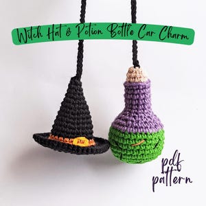 May include: Crocheted car charm featuring a black witch hat with an orange buckle and a purple and green potion bottle. The text "Witch Hat & Potion Bottle Car Charm" is on a green banner. The text "pdf pattern" is also visible.