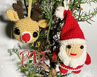 May include: Two crocheted Christmas ornaments, a reindeer and Santa Claus, hanging from a small Christmas tree. The ornaments are both red and white with black eyes and a red nose. The text "2 in 1 PDF pattern" is visible in the image.