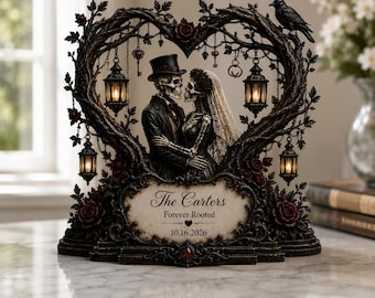 May include: A decorative sculpture featuring two skeletons in wedding attire standing under a heart-shaped tree branch arch. The piece includes four hanging lanterns, a black raven, and a plaque with the text The Carters, Forever Rooted, 10.16.2026.