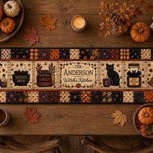 May include: A rectangular table runner featuring a patchwork border in shades of orange, black, and brown. The center panel displays illustrations of a witch hat, a cauldron, books, a black cat, a jar labeled Bat Wings, and text reading The Anderson Witch's Kitchen.