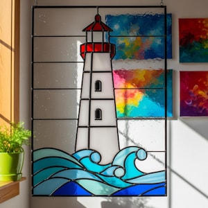 May include: Stained glass panel featuring a white lighthouse with a red roof, set against a backdrop of blue waves. The lighthouse has black outlines and small windows. The panel is framed in black.