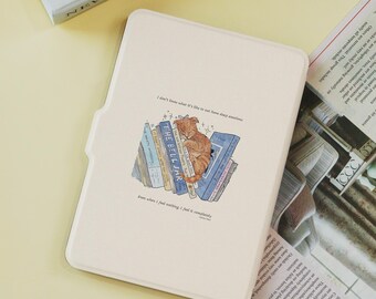 May include: A cream tablet case with a printed illustration of a ginger cat sleeping on a pile of books. The case has text that reads, "I don't know what it's like to not have deep emotions" and "Even when I feel nothing, I feel it completely."