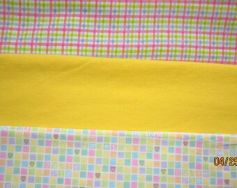 Sweet Baby flannel check,solid yellow and pastel plaid flannel .All three sold by the half yard