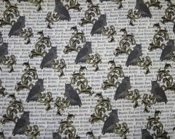May include: A white fabric with a repeating pattern of black and gold stylized owls and floral designs. The fabric has a text pattern that reads "Double Toil and Trouble Double, Double Toil and Trouble Double, Fire Burn and Cauldron Bubble, Fire Burn and Cauldron Bubble".