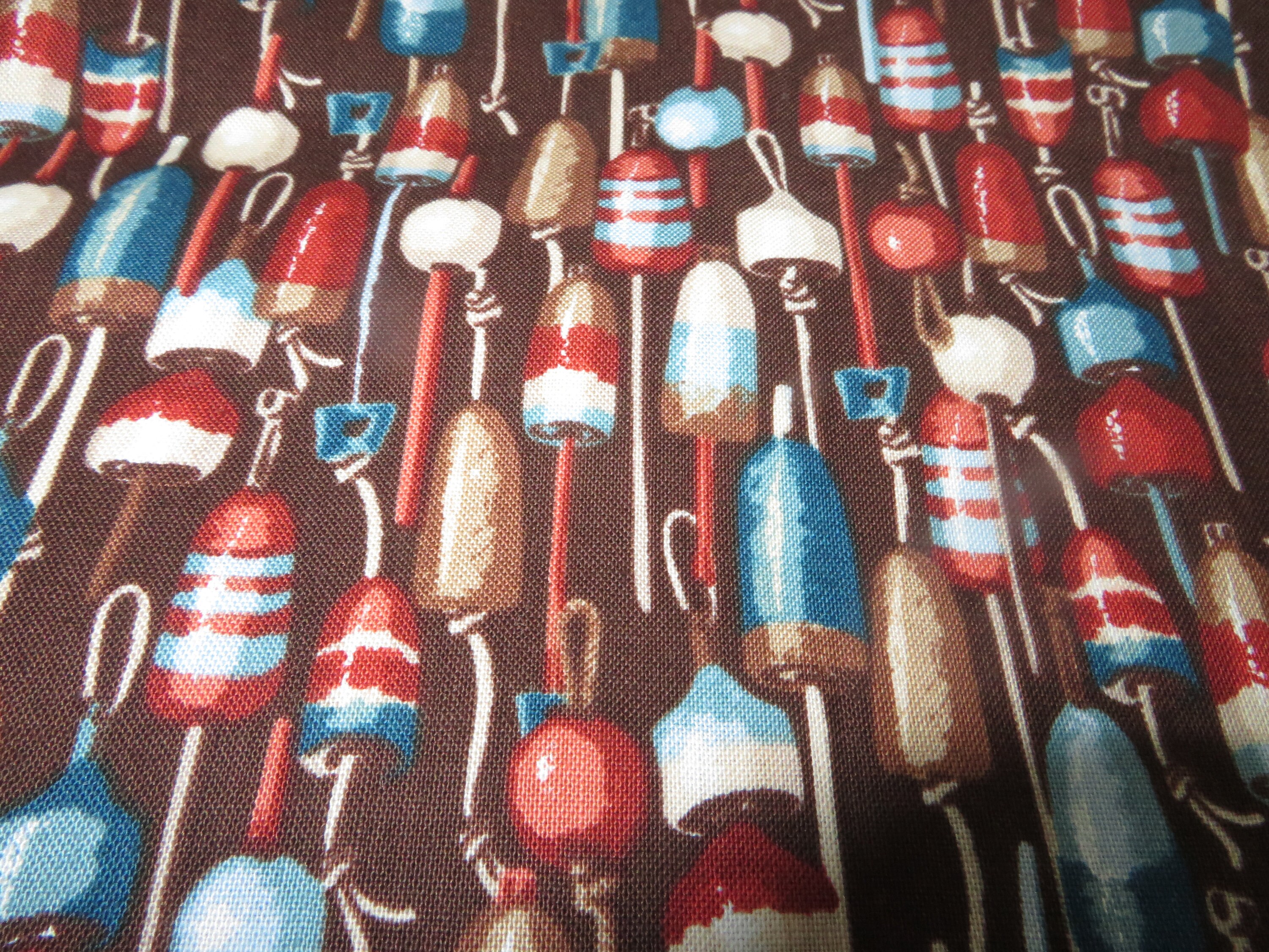 Mariner's Cove Fishing Bobbers On brown fabric sold by the half yard