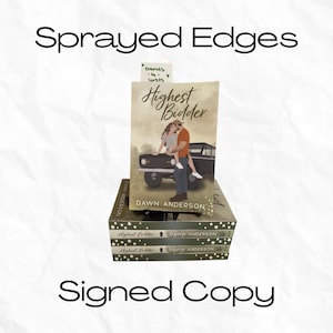 May include: A stack of books with the title "Highest Bidder" by Dawn Anderson. The book covers feature an illustration of a couple and a vintage car. The text "Sprayed Edges" and "Signed Copy" are also visible.